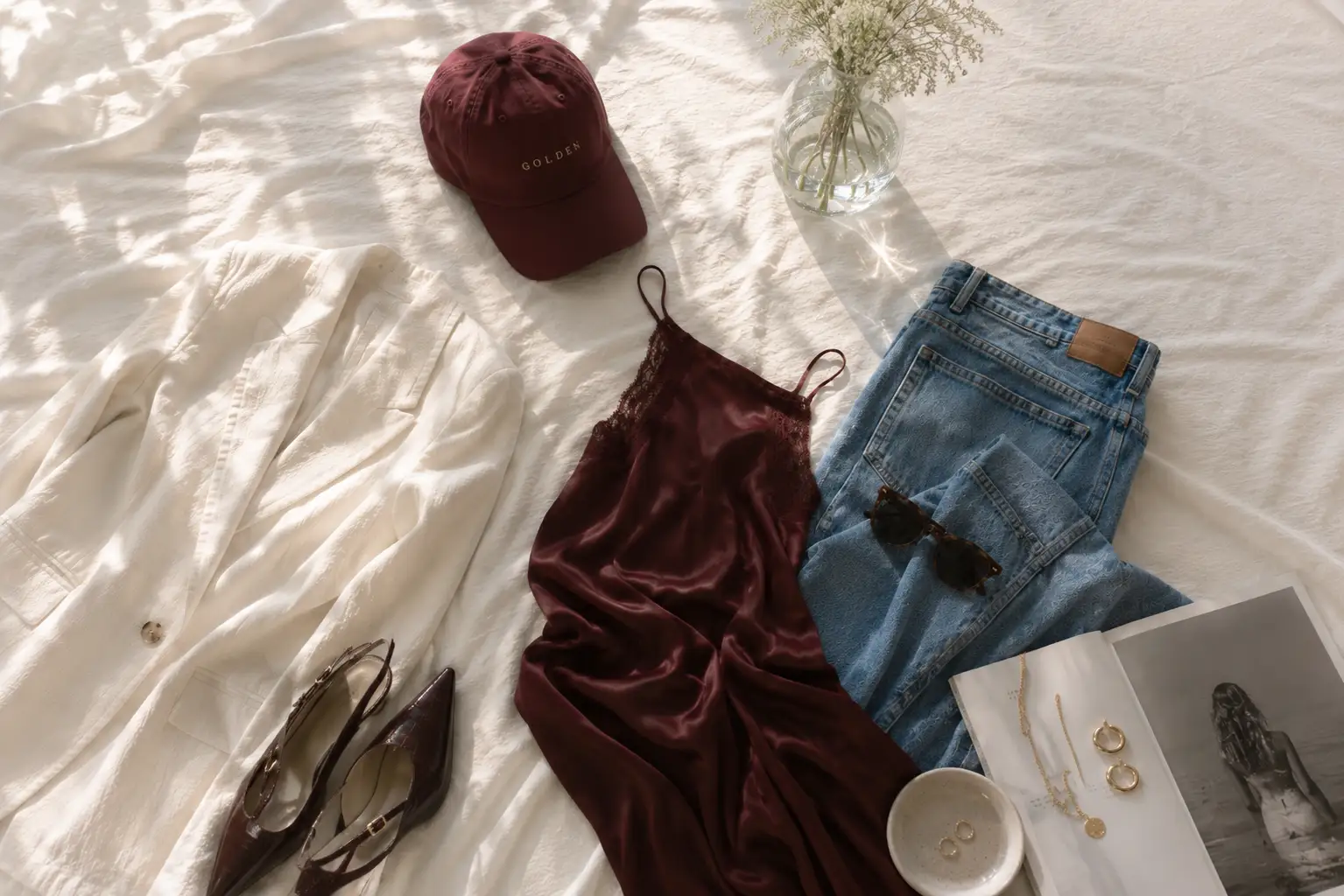 Golden House fashion edit with burgundy cap, top and denim jeans